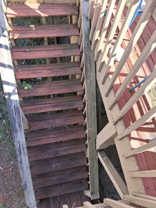 Red-stained deck, railing and exterior timber stairs
