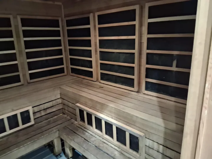 Timber benches, slatted walls and lower windows in a sauna
