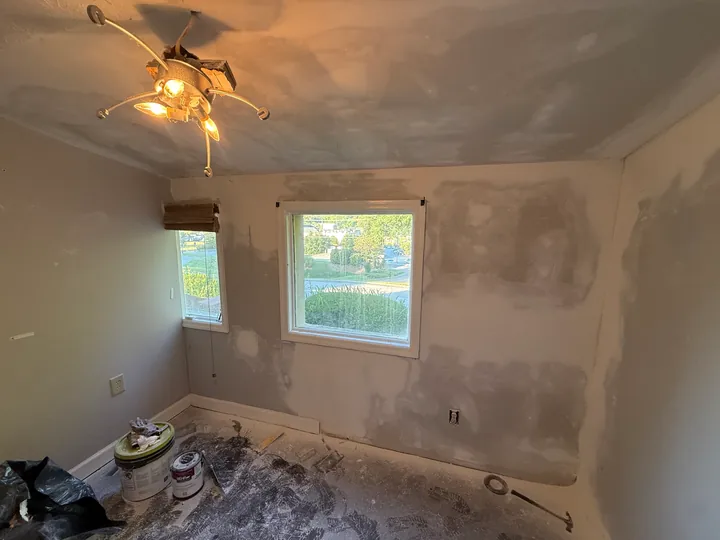 Patched walls and ceiling around two windows during the same room remodel