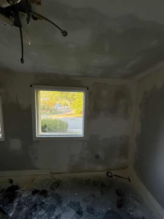 Joint compound on walls and the sloped ceiling before painting