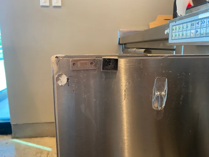 Stainless dishwasher front and its under-counter opening