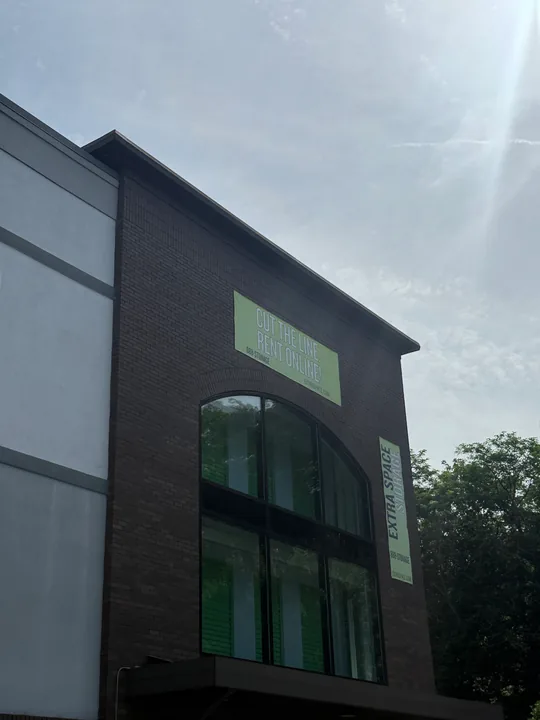 Extra Space Storage exterior with wall fixtures and elevated access equipment