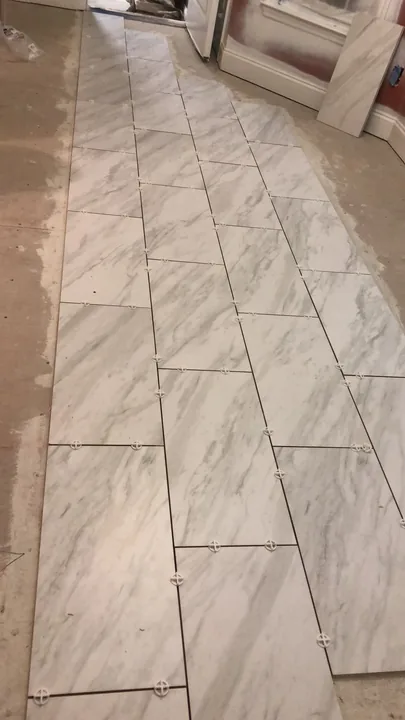 Large rectangular floor tile and doorway transitions