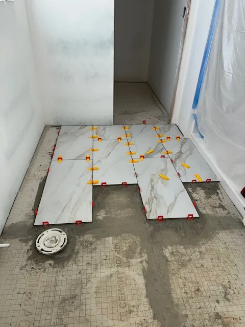 Large floor tiles, leveling spacers and floor preparation