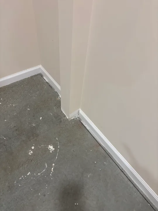 White baseboard, inside corners and wall-trim profiles