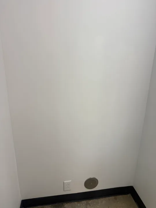 Interior wall repair patches and painted room surfaces