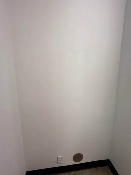 Interior wall repair patches and painted room surfaces