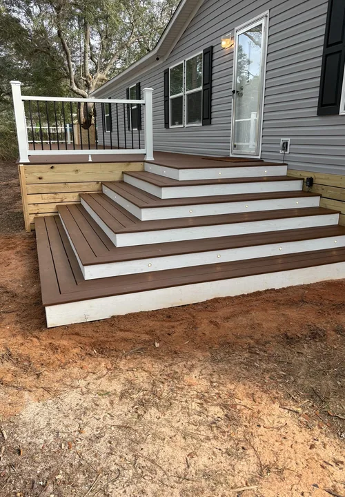 Wide exterior porch steps with white risers and dark treads