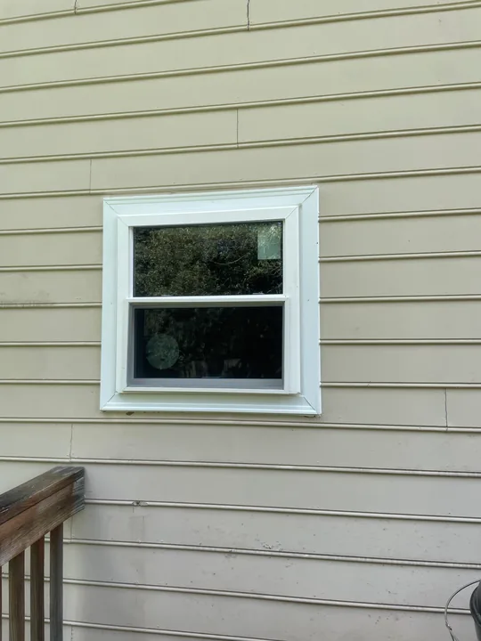 White window frame and trim viewed from outside and inside a room