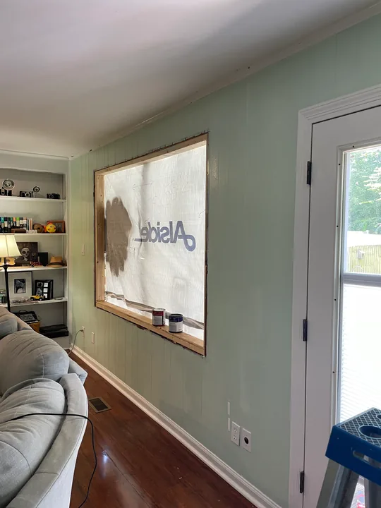 White window frame and trim viewed from outside and inside a room