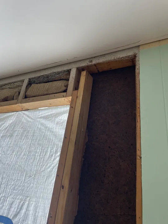 White window frame and trim viewed from outside and inside a room