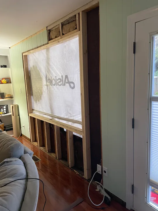 White window frame and trim viewed from outside and inside a room