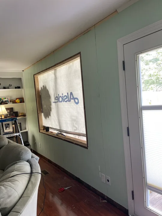 White window frame and trim viewed from outside and inside a room